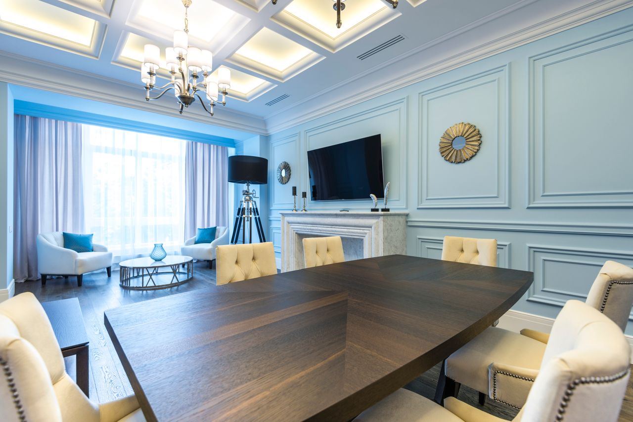 Elegant dining room interior featuring modern design, luxurious decor, and soft lighting.